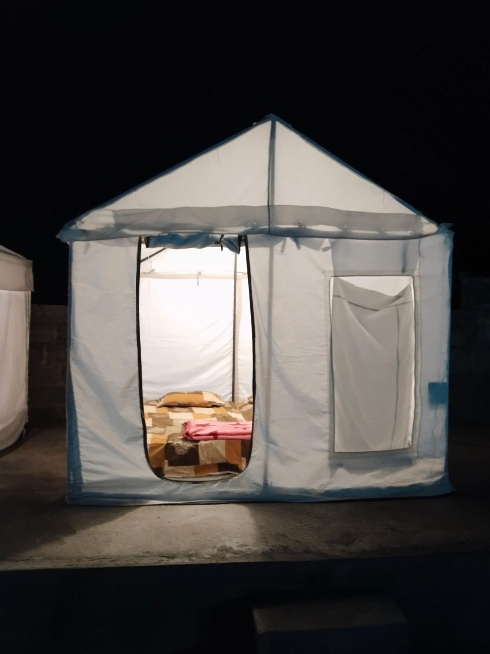 Citadel tent lit up at night