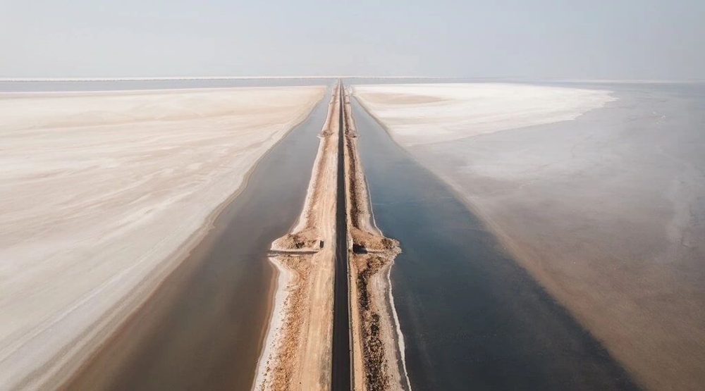 Road crossing the white salt desert